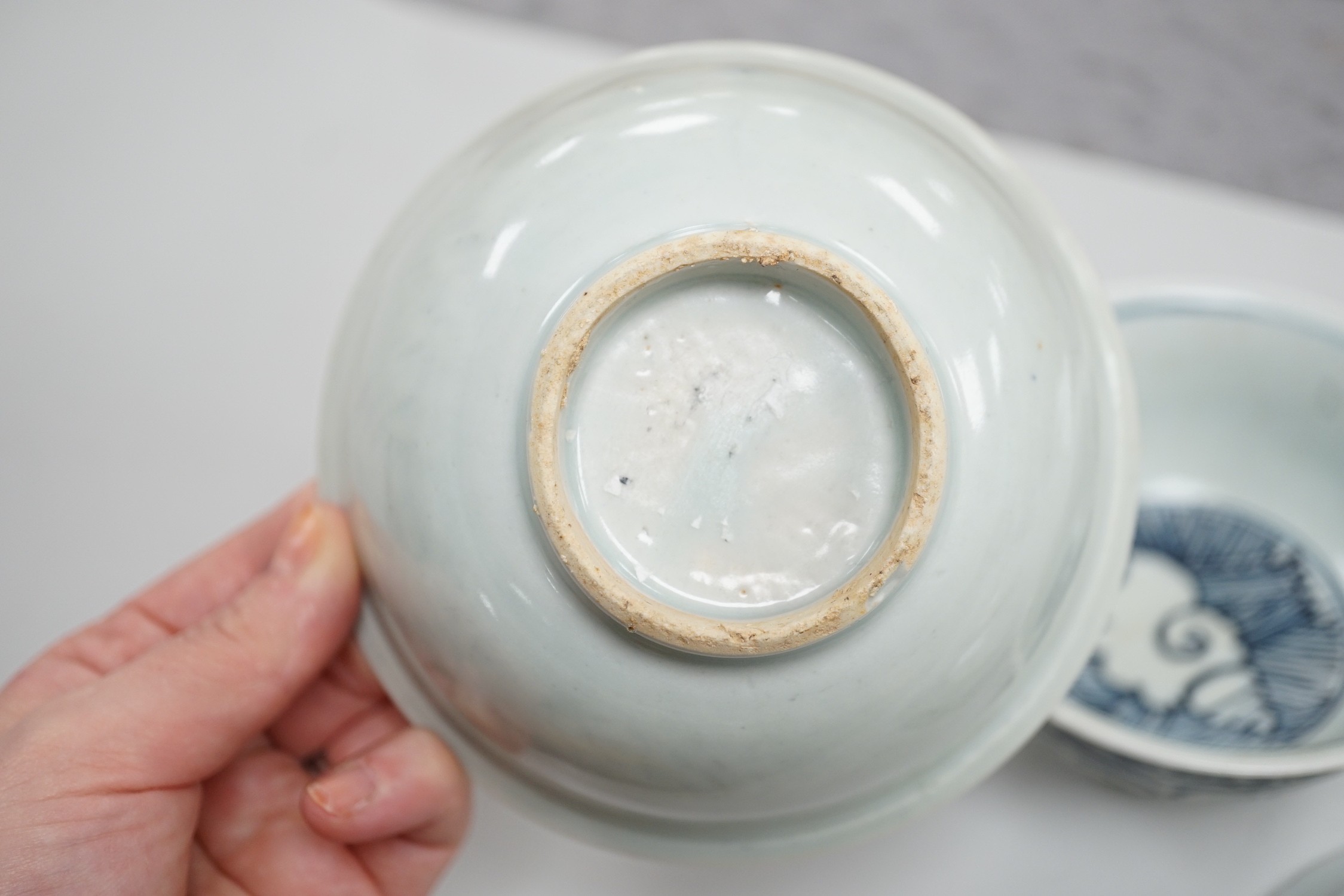 A small Chinese Ming blue and white bowl, and other, together with two small saucers (4)